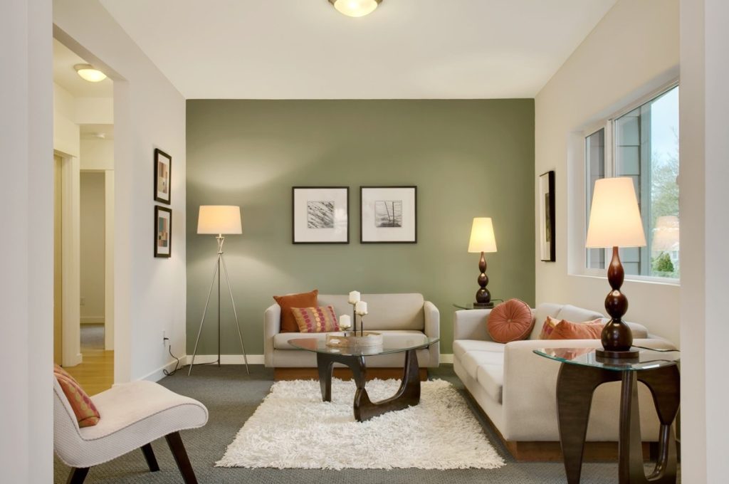 Soft green accent wall living room